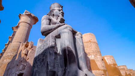 huge statue of Ramesses II in Luxor Temple, Egypt