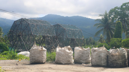 waste sorting machine in tropical environnement and mountainの写真素材