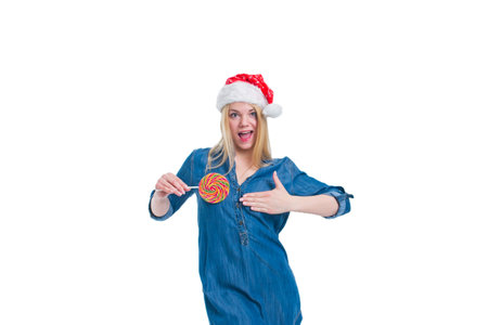 santa hat woman holding a lollipop in white screenの写真素材