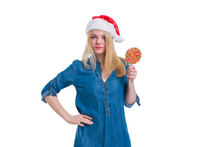 santa hat woman holding a lollipop in white screenの写真素材