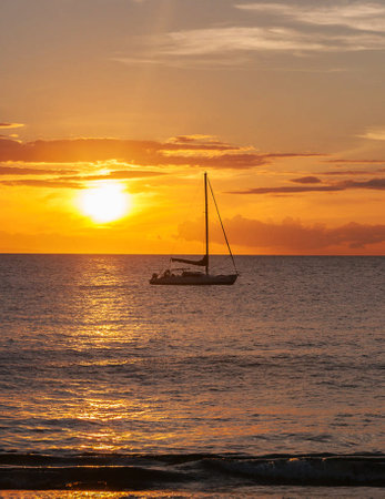 Sailboat at sunset on the Caribbean Sea, Dominican Republic.の写真素材