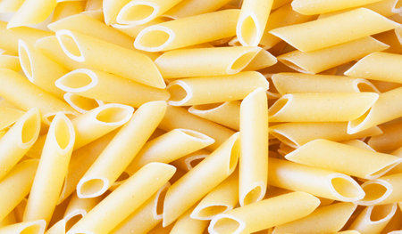 close up of penne pasta on white background - food and drinkの写真素材