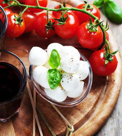 Caprese salad with mozzarella cheese, tomatoes and basilの写真素材