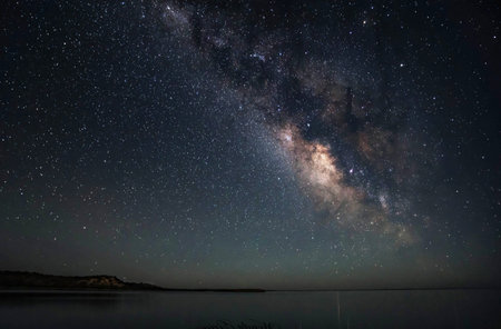 Milky way over lake with stars and space dust in the universeの写真素材