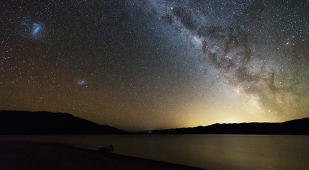Milky Way over the lake at night. Long exposure photograph.