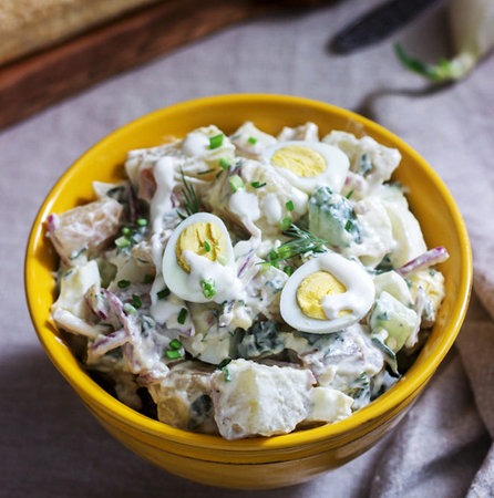 Traditional Russian salad Olivier with eggs, dill and mayonnaiseの写真素材