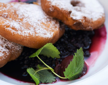 Doughnuts with black currant jam and mint. Selective focus.の写真素材