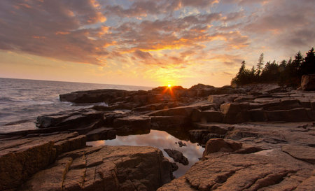 Sunset on the rocky coast of the Pacific Ocean. California, USA.の写真素材