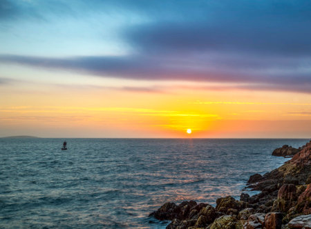 Sunset over the sea in Tossa de Mar, Costa Brava, Spainの写真素材