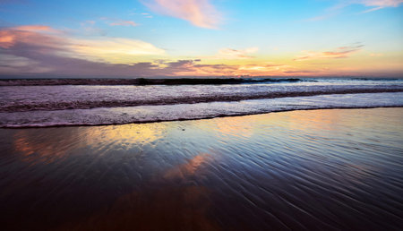 Beautiful sunset on the beach. Colorful sky and sea.の写真素材