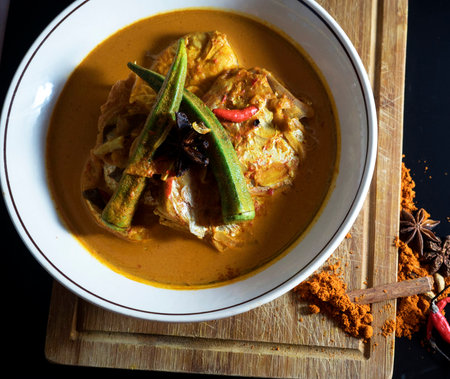 Curry fish with chili and eggplant on wooden board, Thai foodの写真素材