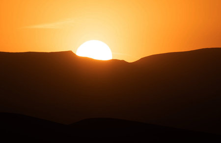 Sunset over the sand dunes in the Sahara desert, Moroccoの写真素材