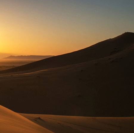 sunset in the desert of sahara, moroccoの写真素材