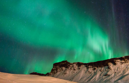 Aurora borealis, northern light in the mountains of Icelandの写真素材
