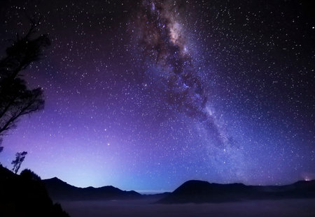 Milky Way over the mountains at Doi Inthanon National Park, Thailandの写真素材