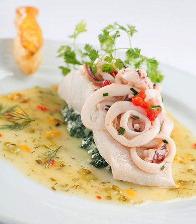 Seafood carpaccio with spinach, red onion and parsleyの写真素材