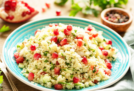 Tabbouleh salad with couscous, pomegranate and parsleyの写真素材