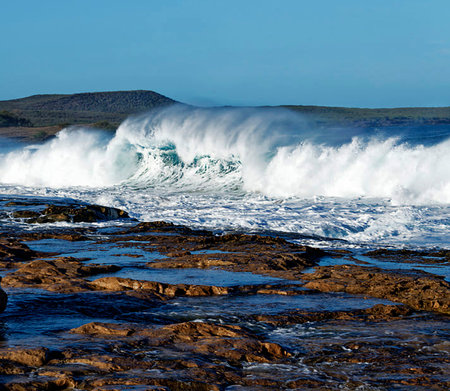 Big wave breaking on the rocks in the Atlantic Ocean, Portugal.の写真素材