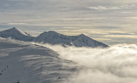 Mountain panorama in the clouds, ski resort in Tyrol, Austria