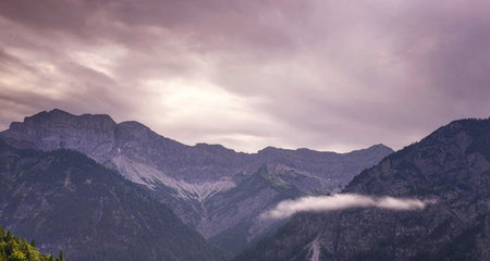 Dramatic cloudscape over the alpine mountain range in summerの写真素材