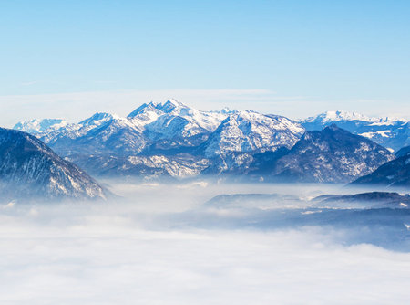 Mountains in the clouds. View from the top of the mountain.の写真素材