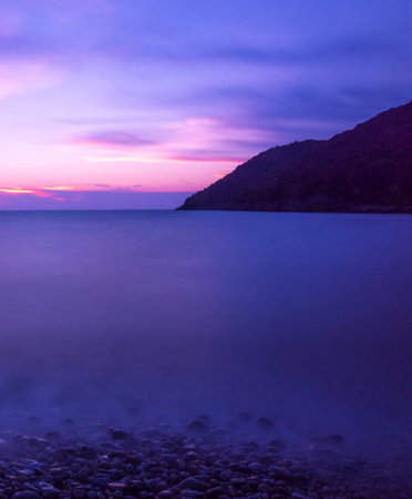 Sunset over the sea in Sicily, Italy. Long exposure.の写真素材