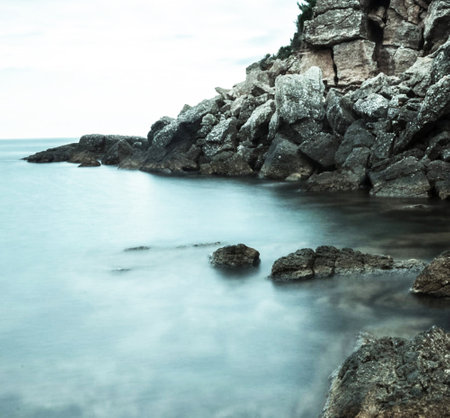 beautiful seascape with rocks and sea water, long exposureの写真素材