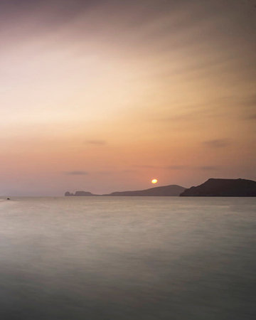 Sunset over the sea in Ibiza, Balearic Islands, Spainの写真素材