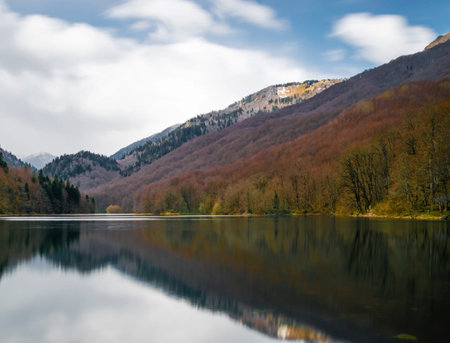 Reflection of mountains and trees in the lake, Carpathians, Ukraineの写真素材