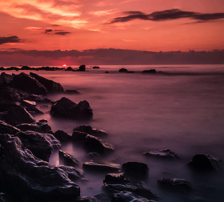 Beautiful seascape at sunset. Dramatic sky and sea.の写真素材