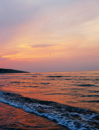 Sunset on the beach in the summer. Beautiful sunset over the sea.の写真素材