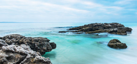 beautiful seascape with rocks and turquoise water. long exposureの写真素材