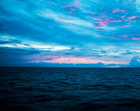 beautiful sunset over the sea. Dramatic sky with glowing cloudsの写真素材