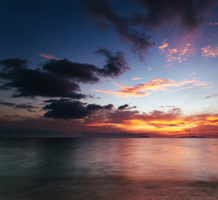 Beautiful sunset over the sea. Colorful sky and clouds.の写真素材