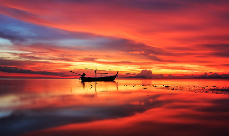 Fishing boat on the sea at beautiful sunset,Thailand.の写真素材