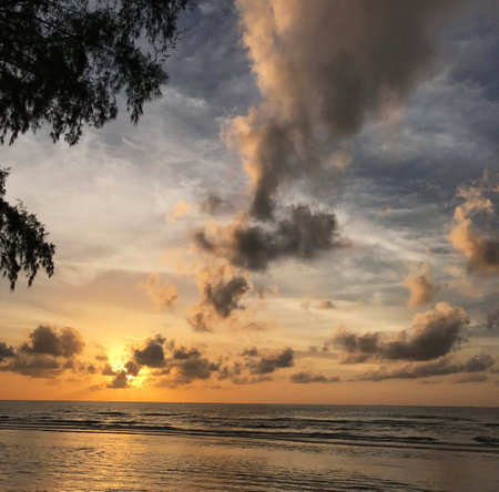 Sunset on the beach of the island of Bali, Indonesiaの写真素材