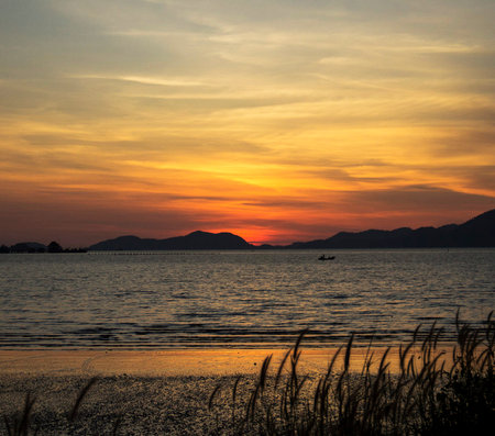 Sunset at the lake in the evening. Beautiful nature landscape.の写真素材
