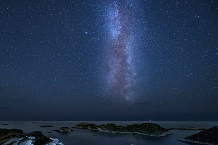 Milky Way over the sea in Norway. Long exposure photograph.の写真素材