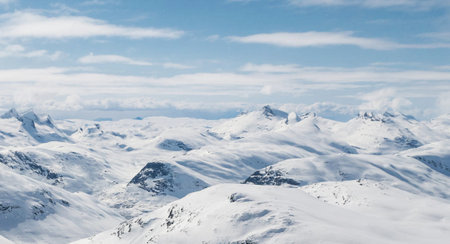 Panoramic view of the snowy mountains of the French Alps.