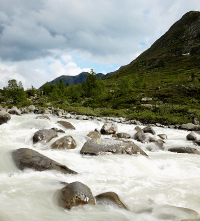 Mountain river flowing through rocks in highlands of Scotland, UK
