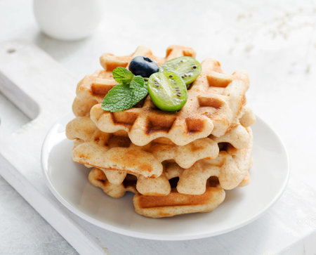 Homemade belgian waffles with fresh blueberries and honey, squareの写真素材