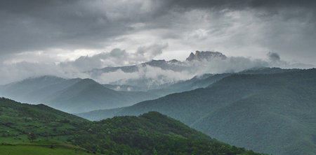 Panoramic view of the mountains in the clouds. Caucasus Mountains, Georgia.の写真素材