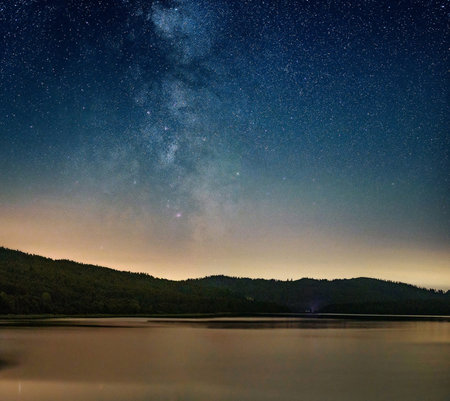 Milky way over the lake at night. Long exposure photograph.の写真素材