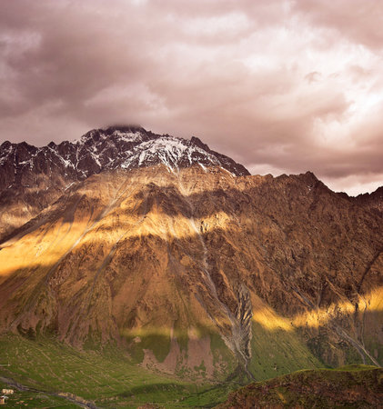 Mountain landscape at sunset. Caucasus Mountains, Georgia, region Gudauri.