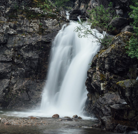 Beautiful waterfall in the mountains of Norway. Long exposure photo.の写真素材