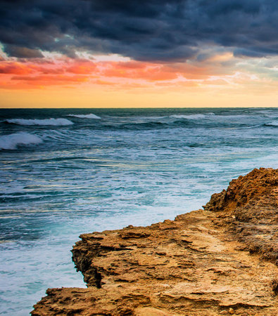 Beautiful seascape at sunset. Dramatic sky, natural composition.の写真素材
