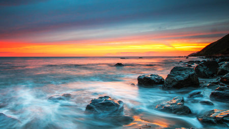 Beautiful seascape at sunset. Dramatic sky, long exposure