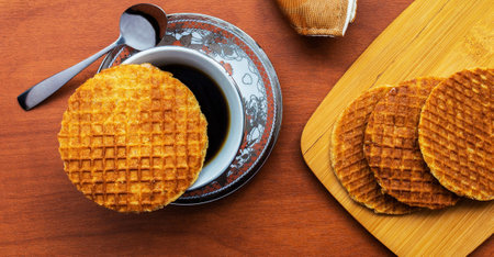 Waffles and coffee on a wooden background. View from above.の写真素材