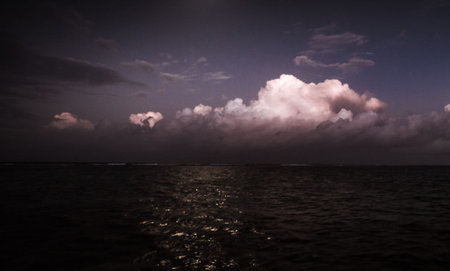 Stormy sky over the sea in the evening. Dramatic clouds.の写真素材
