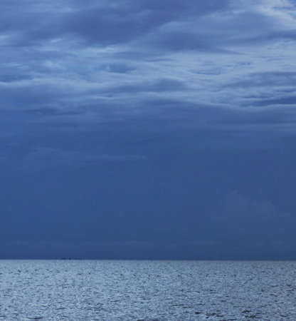 Stormy sky over the sea. Nature composition. Blue sky and clouds.